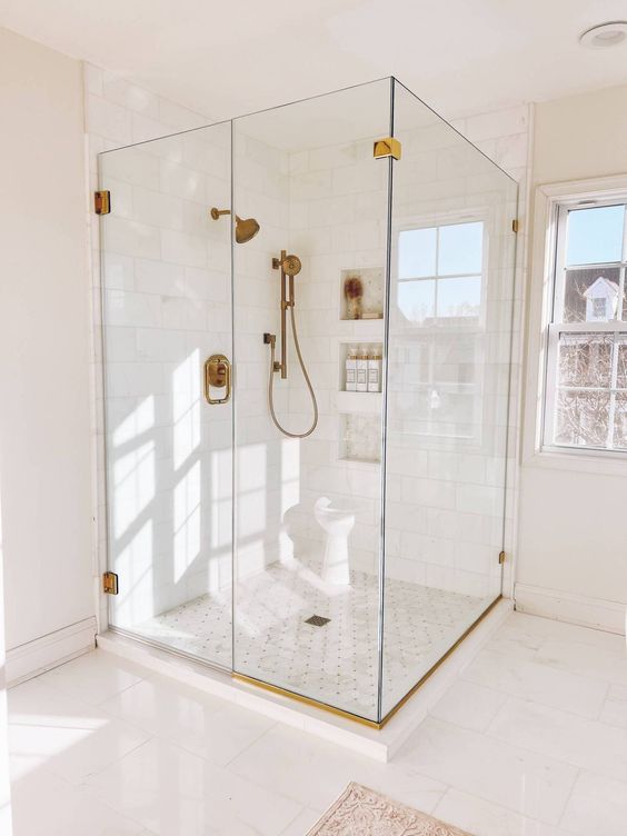 Airy and Light-Filled Bathroom with Brass Accents