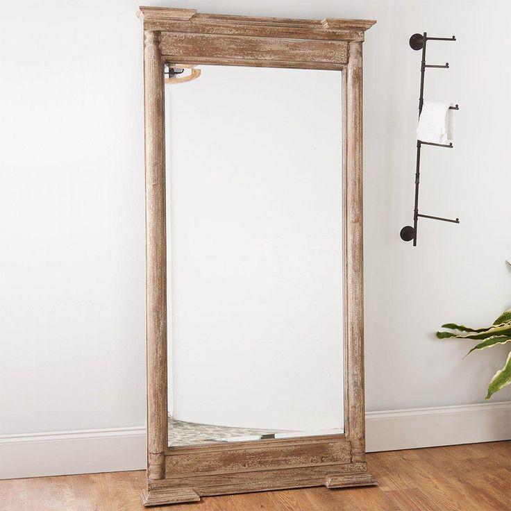 Rustic Elegance with a Distressed Wooden Mantle Mirror