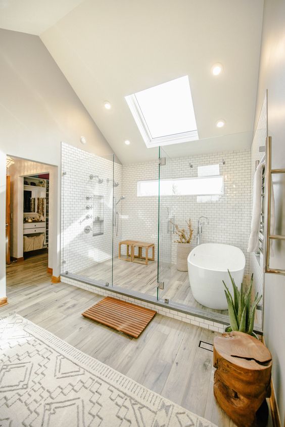 Cozy Attic Bathroom with Skylight and Greenery