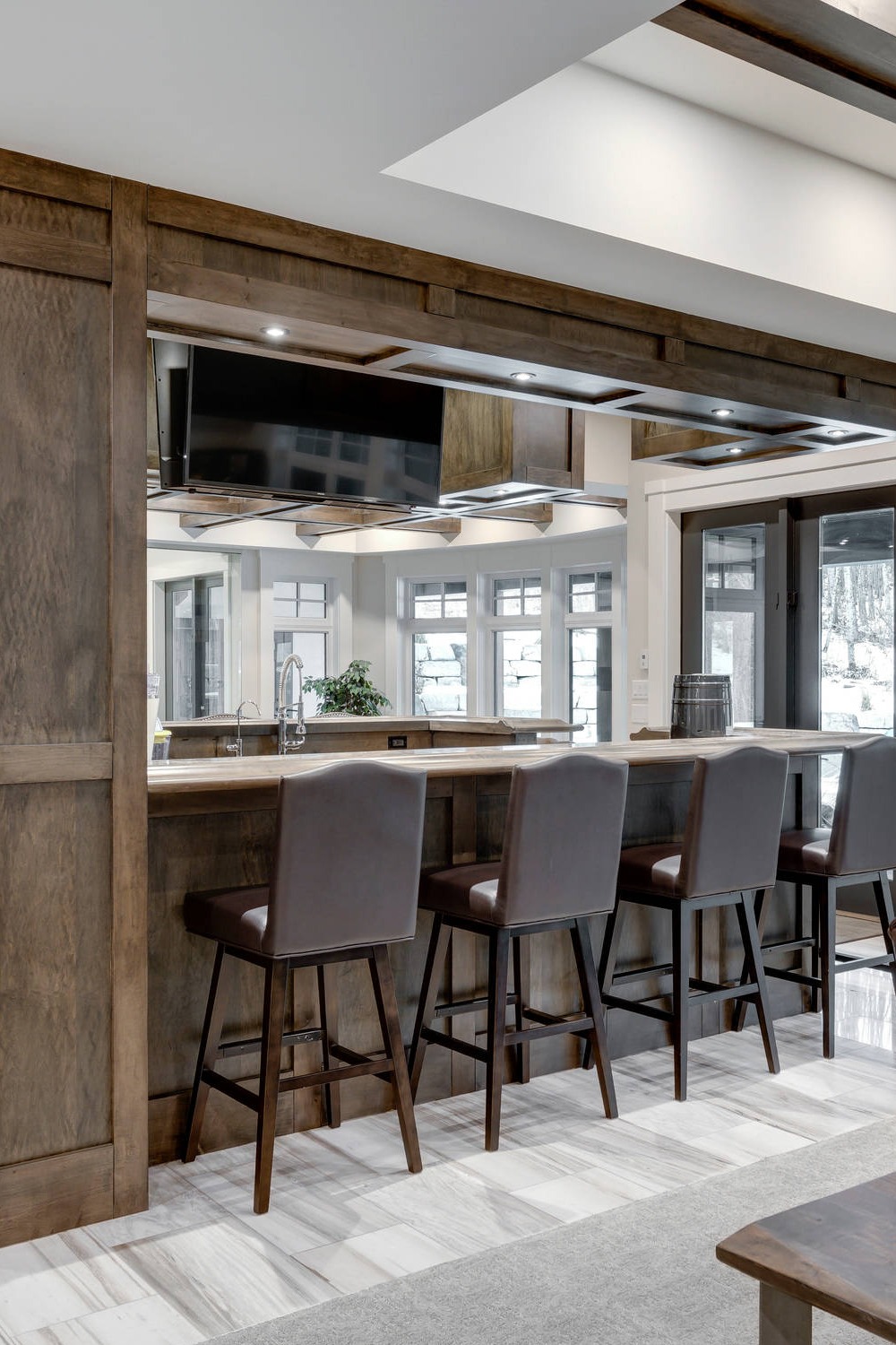 Modern Basement Bar with Neutral Palette and Sleek Design