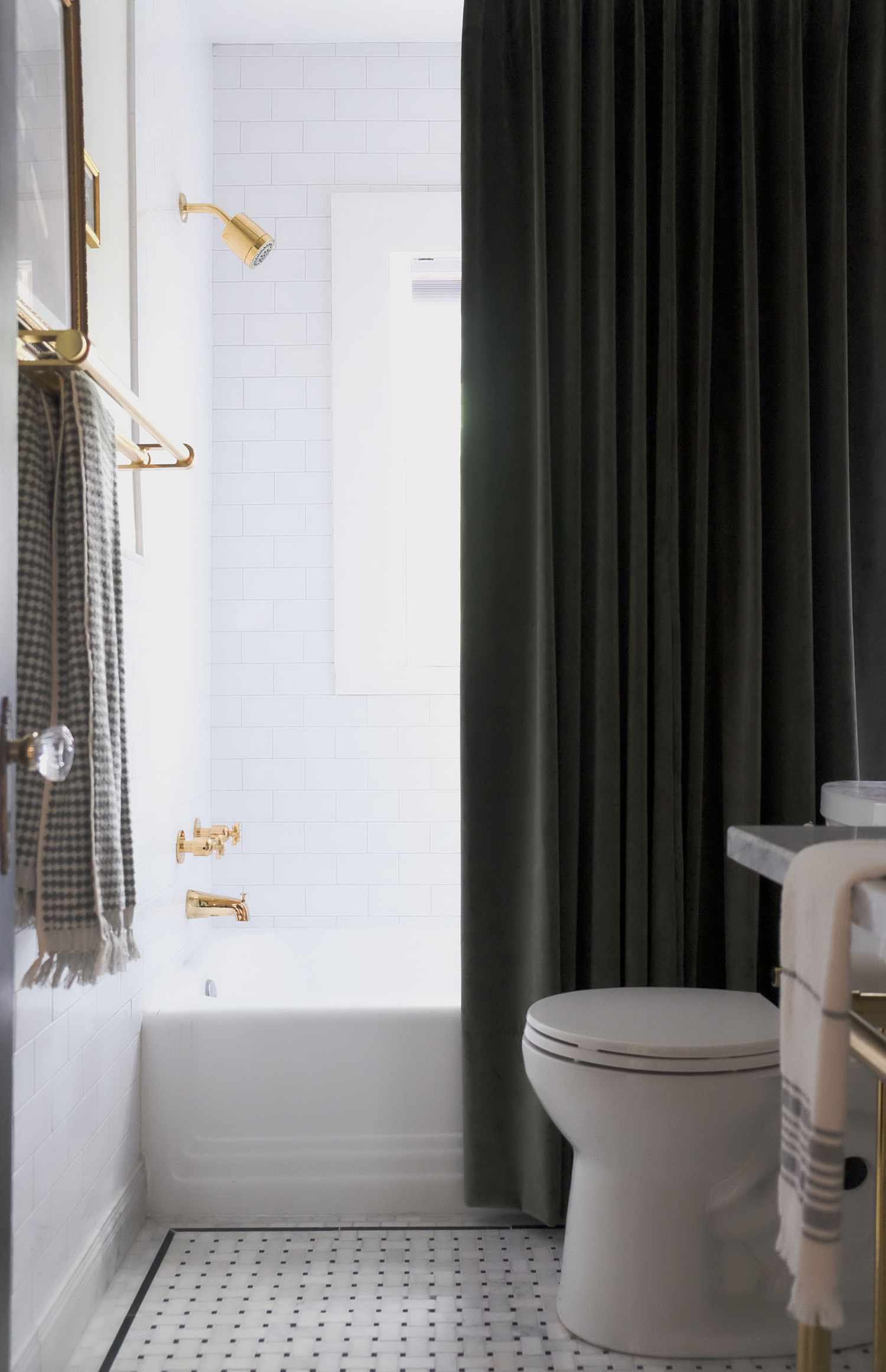 Industrial Chic Black and White Bathroom with Bold Black Fixtures