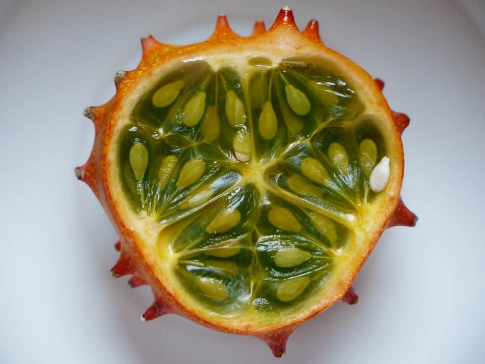 Kiwano fruit with orange spiky skin and emerald green interior