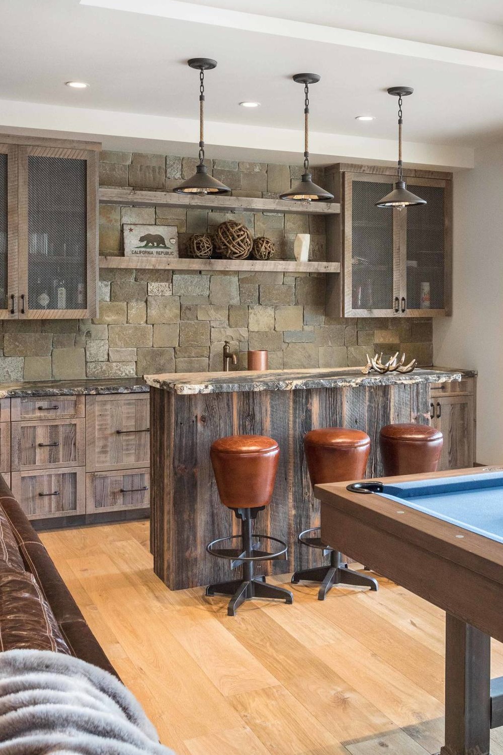 Basement Bar with Stone Accents and Open Shelving