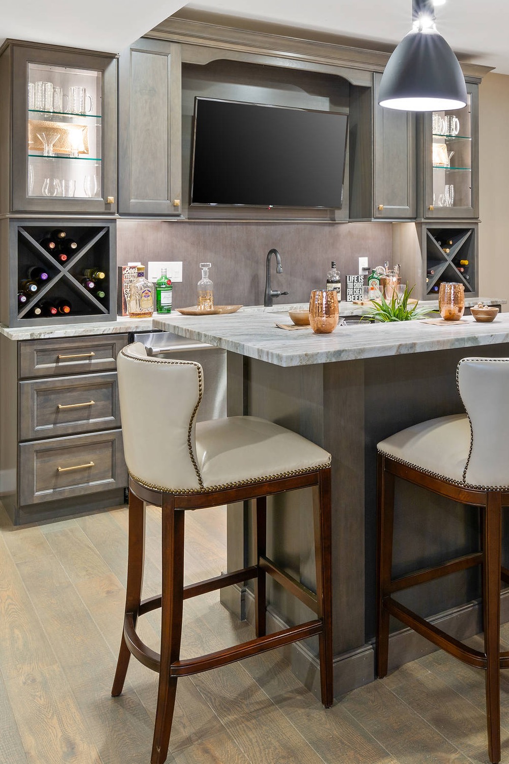 Bright Basement Bar with Functional Storage and Light Tones