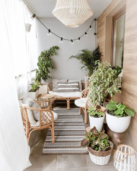 A Cozy Modern Balcony with Rattan Furniture and Lights