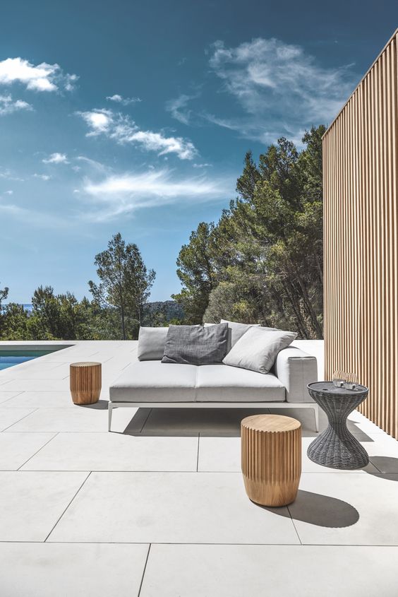 Modern Outdoor Daybed with Pillows and Rattan Side Tables