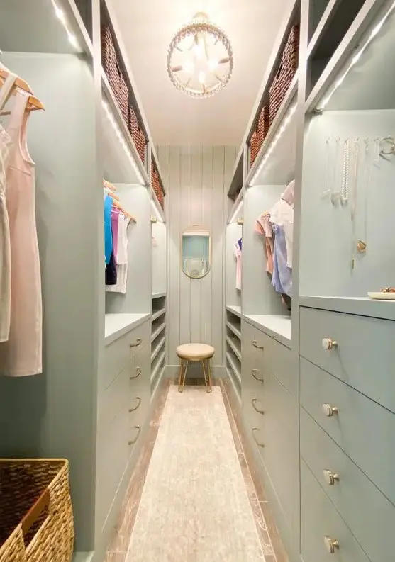 Mint Green Closet with Lit-Up Shelves and Chandelier