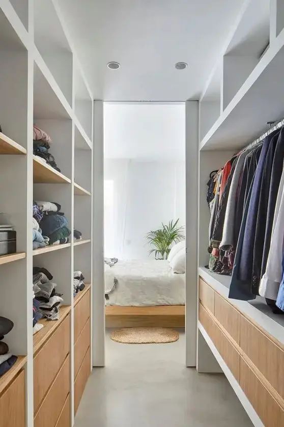 Narrow Walk-In Closet with Built-In Lighting