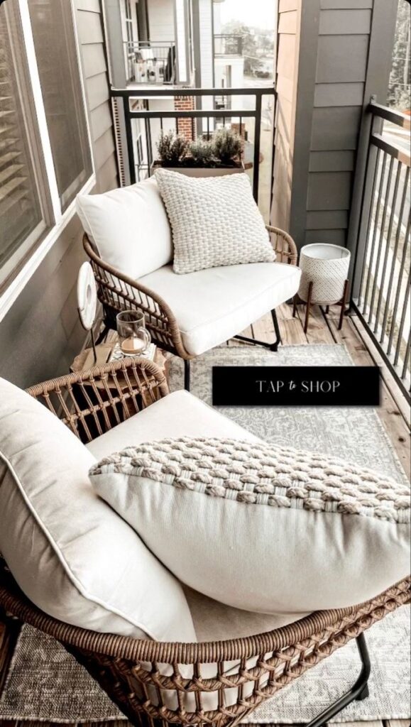 Boho Balcony with Layered Rugs, Wicker Furniture, and Potted Plants