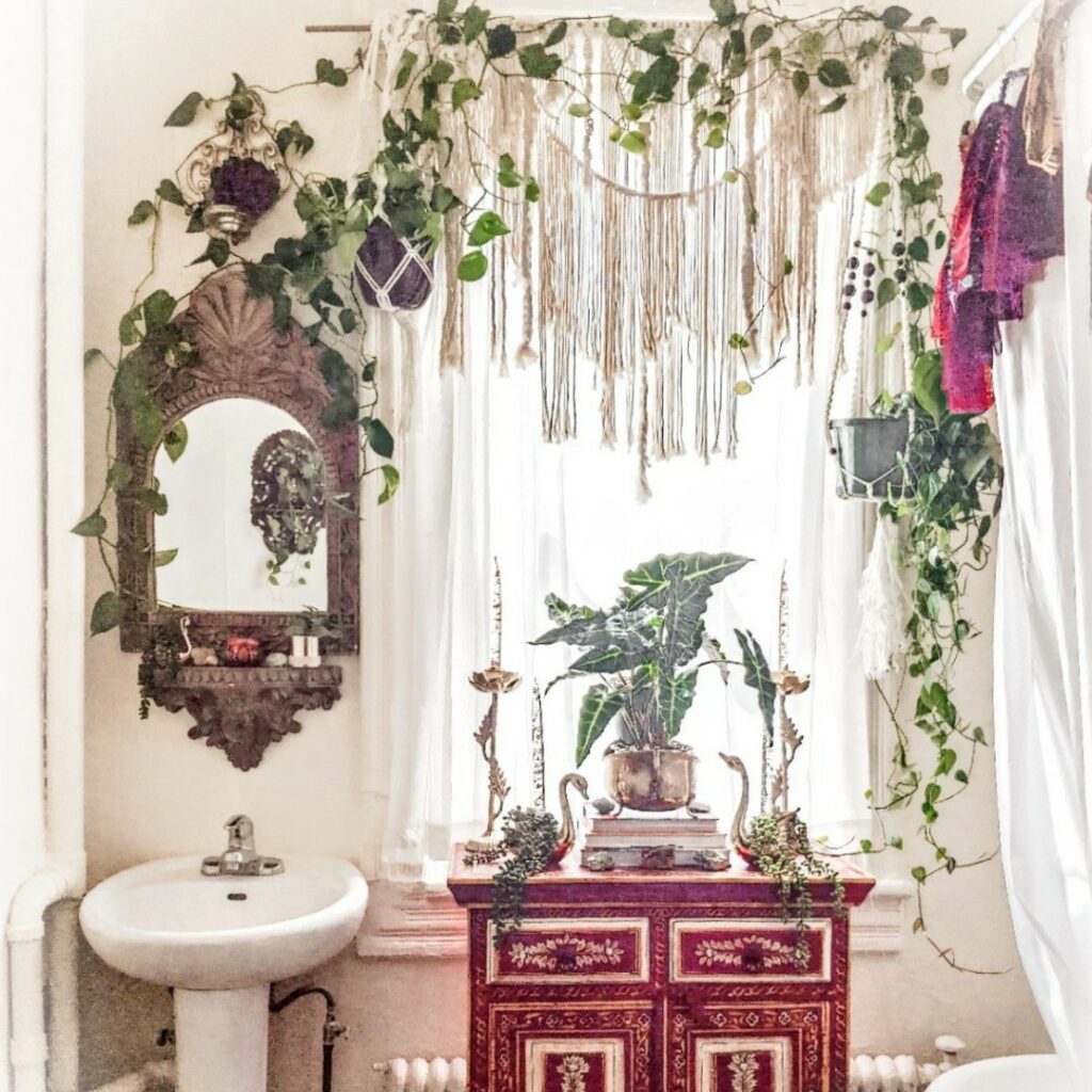 Boho bathroom shower area with lush greenery