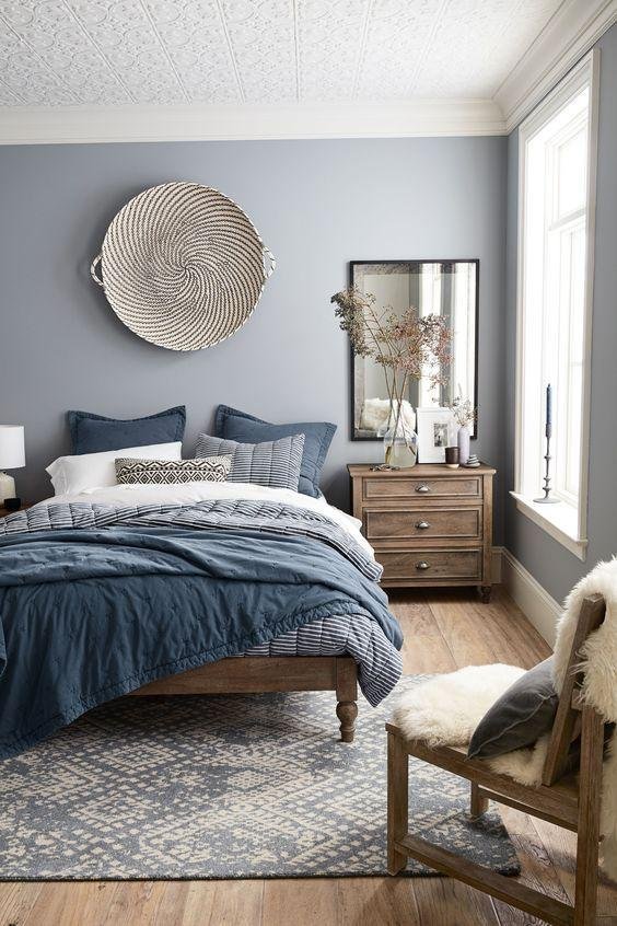 Patterned Curtains with Layered Textiles and Rugs