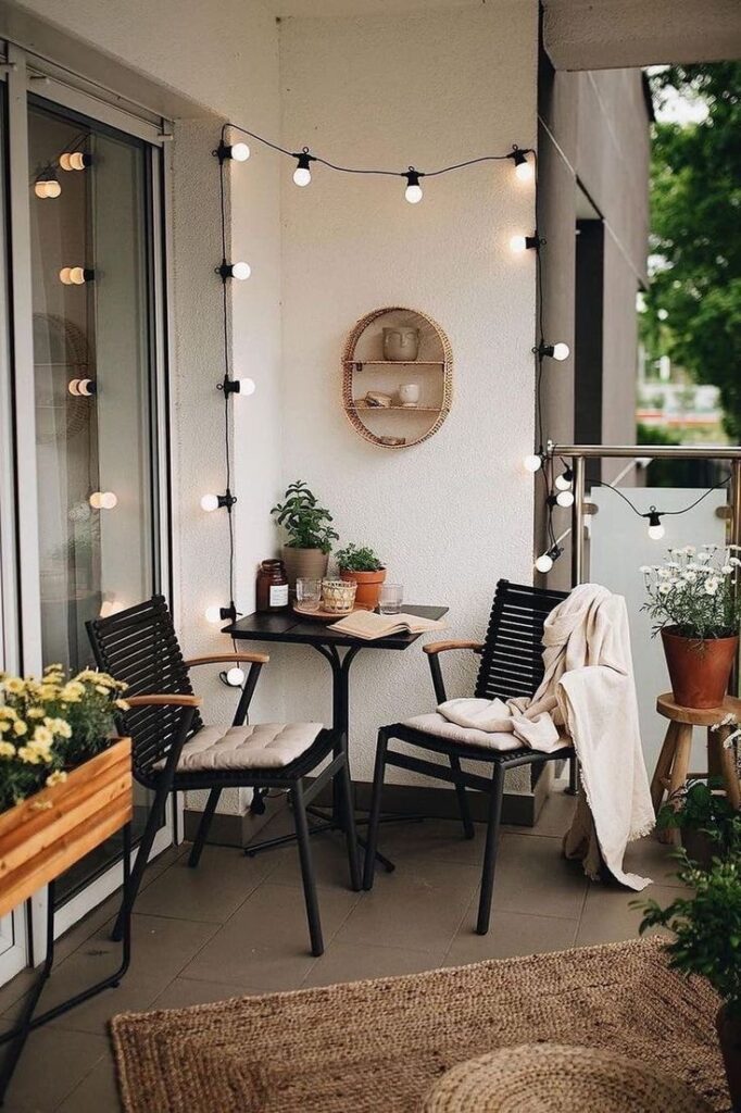 Compact Balcony with Layered Green Plants and Wooden Flooring